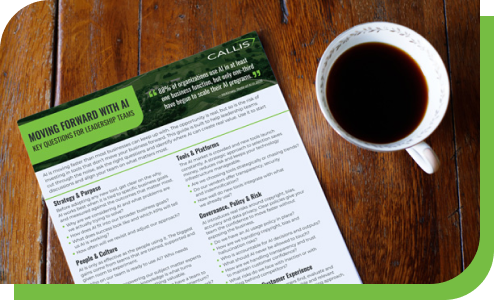 The Moving Forward with AI guide sitting on a table next to a coffee.